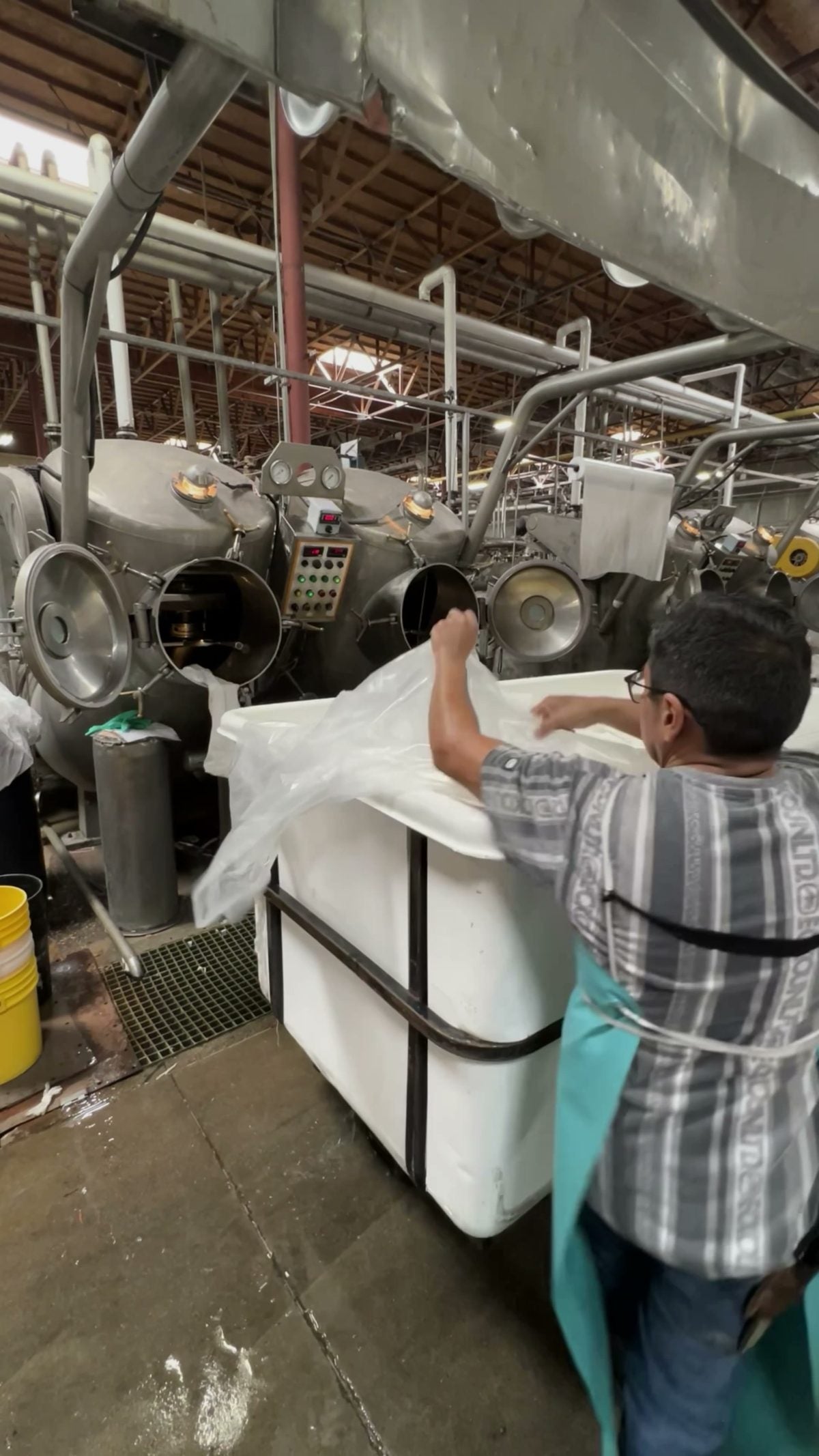 Loading fabric into a machine at Los Angeles Apparel