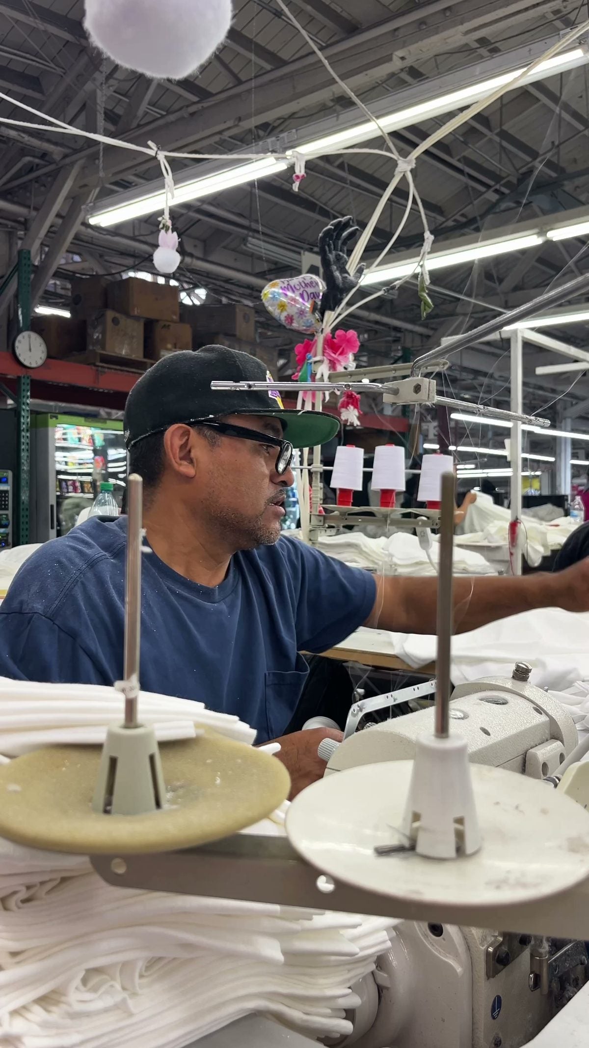 A worker sewing at Los Angeles Apparel