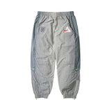 Palace x Nike England Solo Swoosh Track Pants 'Pewter Grey/Cool Grey/Bright Crimson' view 1